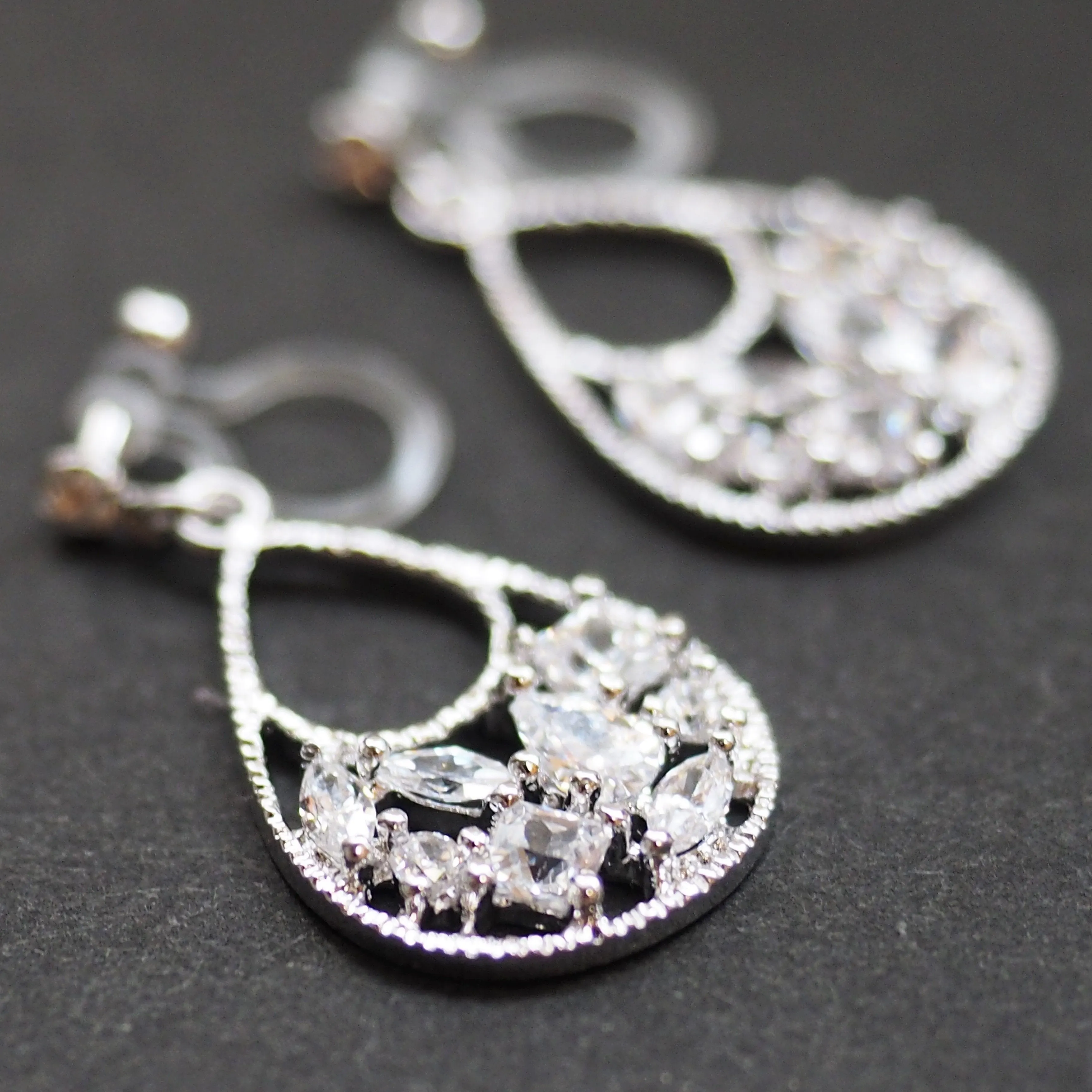 Teardrop filigree cubic zirconia invisible clip on earrings (silver tone)