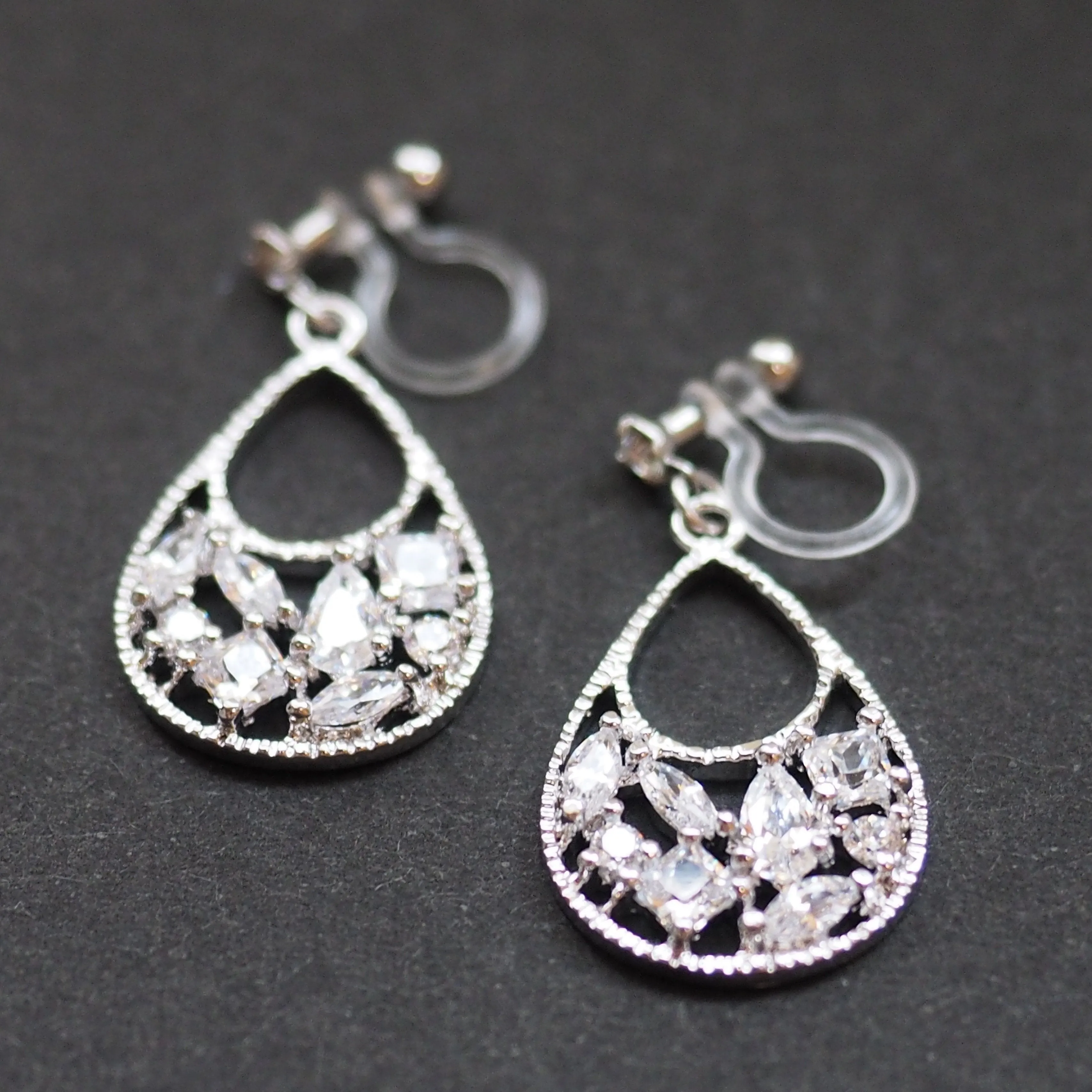 Teardrop filigree cubic zirconia invisible clip on earrings (silver tone)