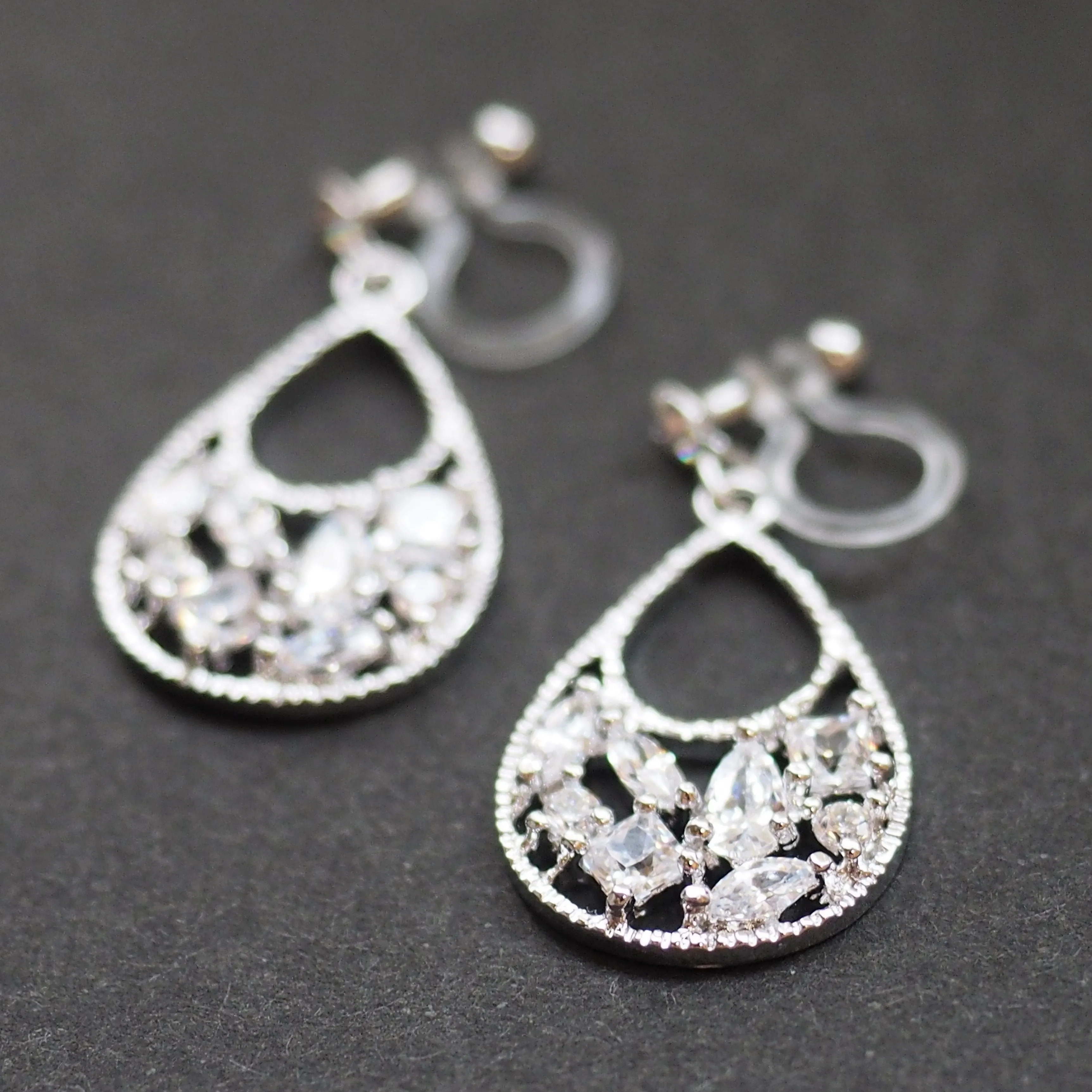 Teardrop filigree cubic zirconia invisible clip on earrings (silver tone)