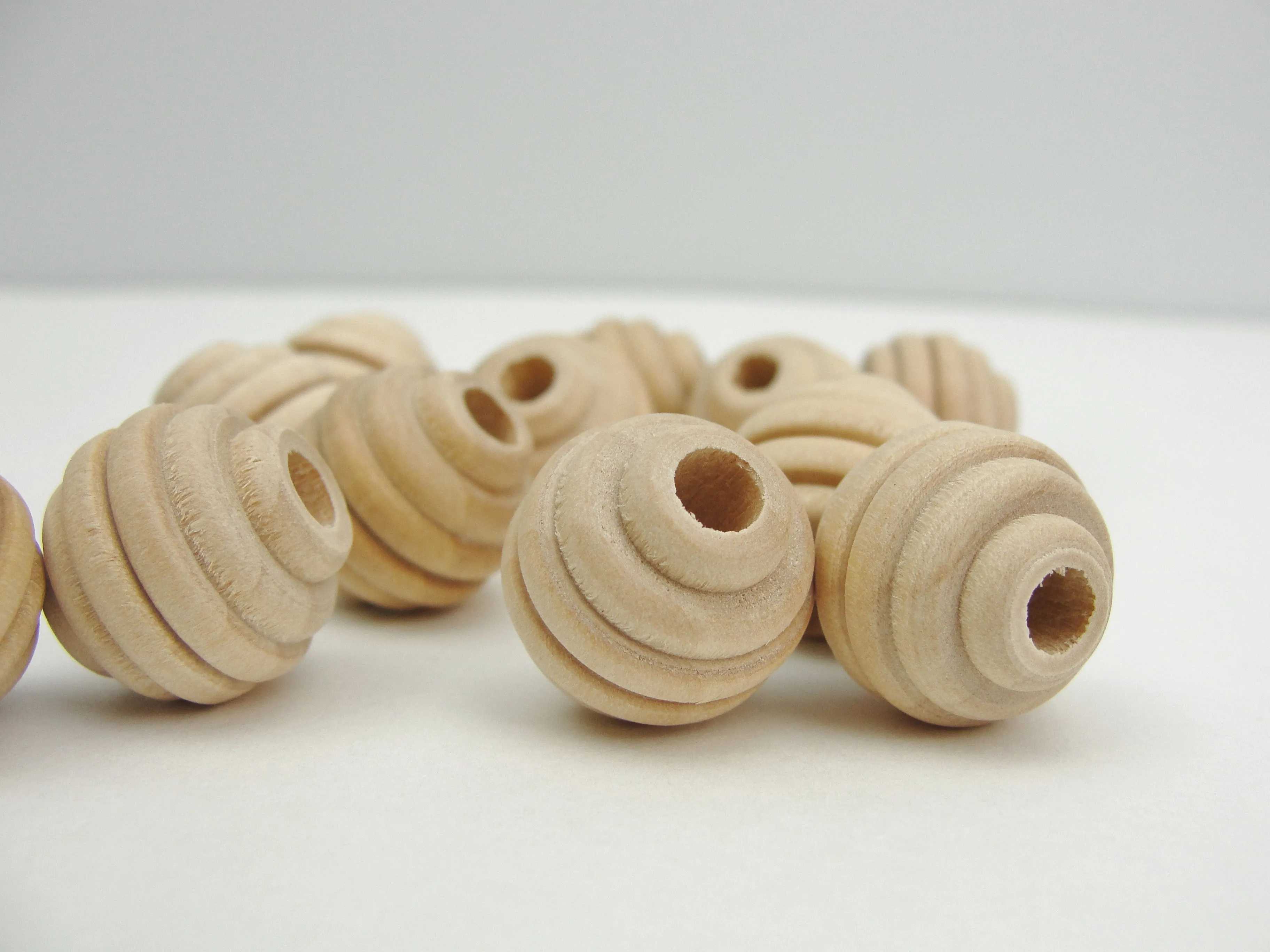Wood beehive beads 5/8" with a 3/16" hole