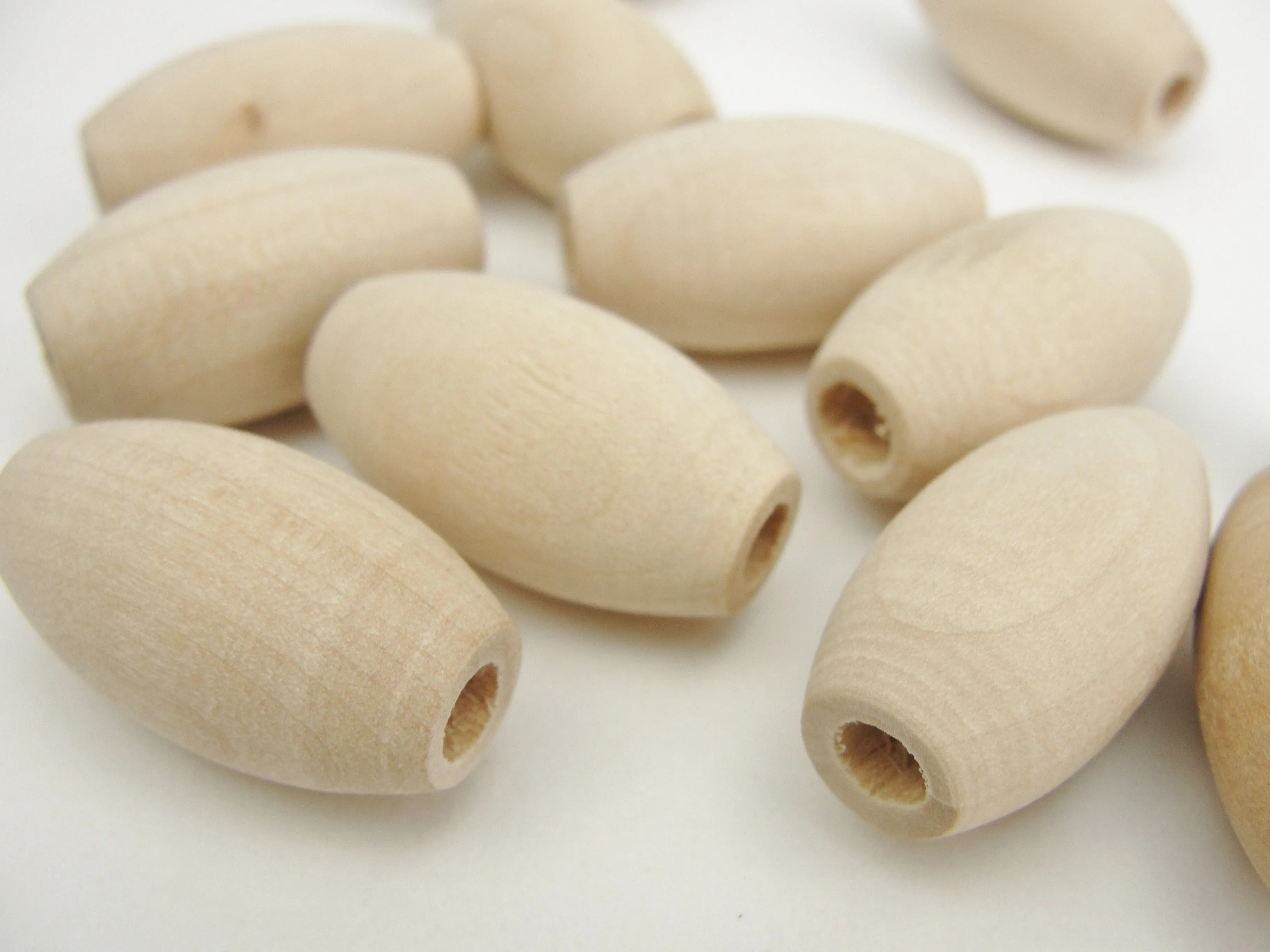 Wooden oval beads 1" x 9/16" with a 3/16" hole