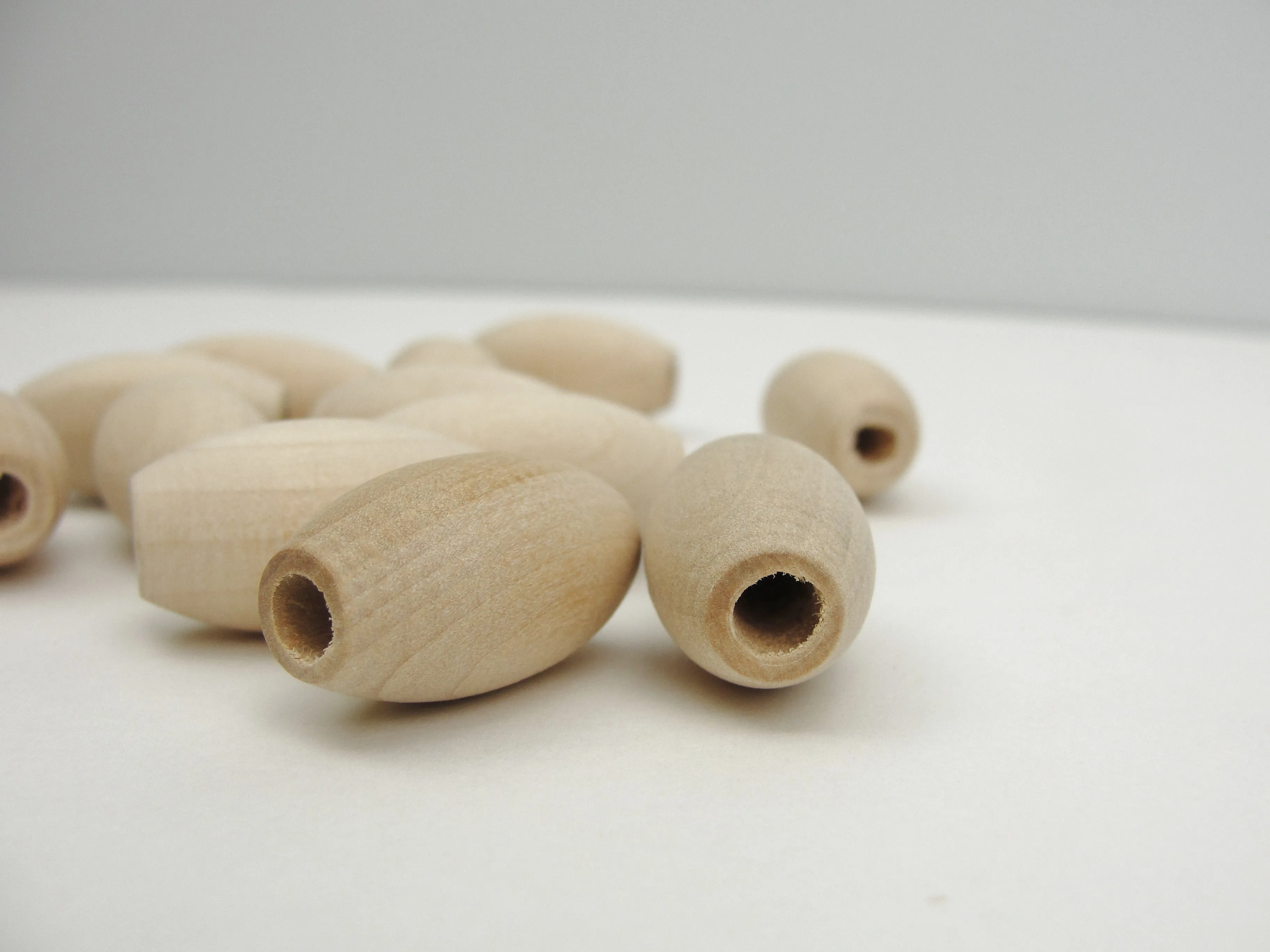 Wooden oval beads 1" x 9/16" with a 3/16" hole