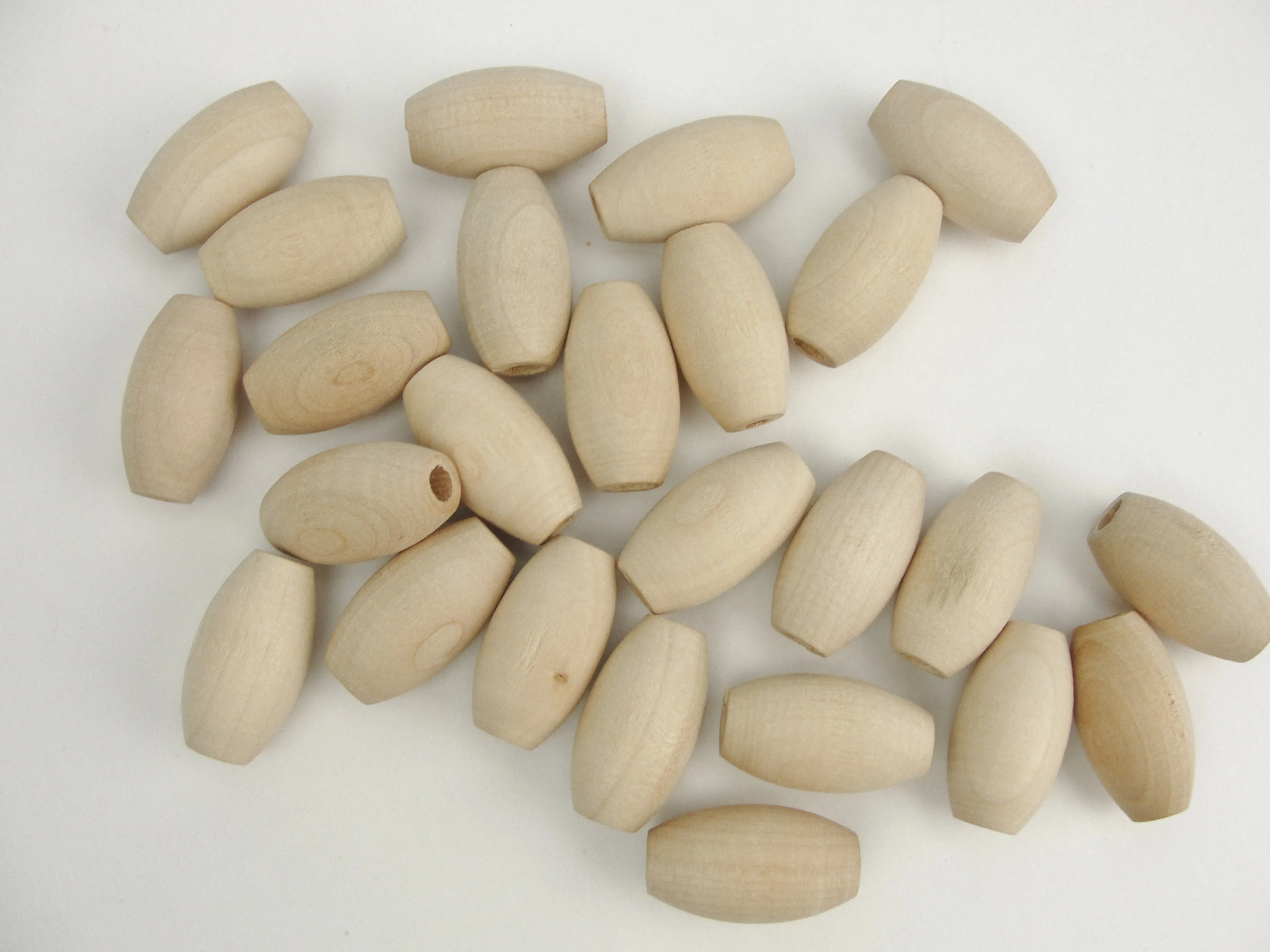 Wooden oval beads 1" x 9/16" with a 3/16" hole