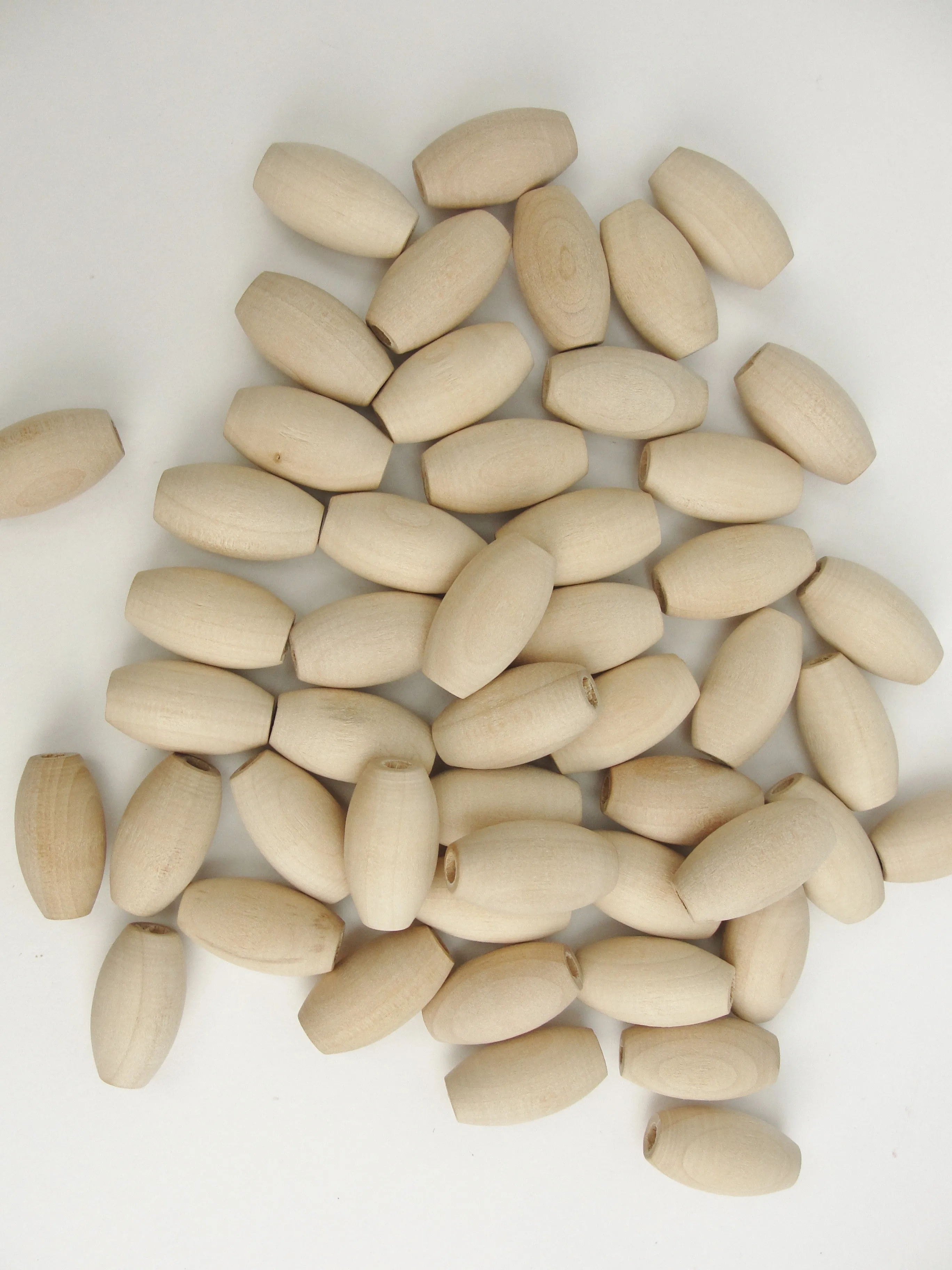Wooden oval beads 1" x 9/16" with a 3/16" hole