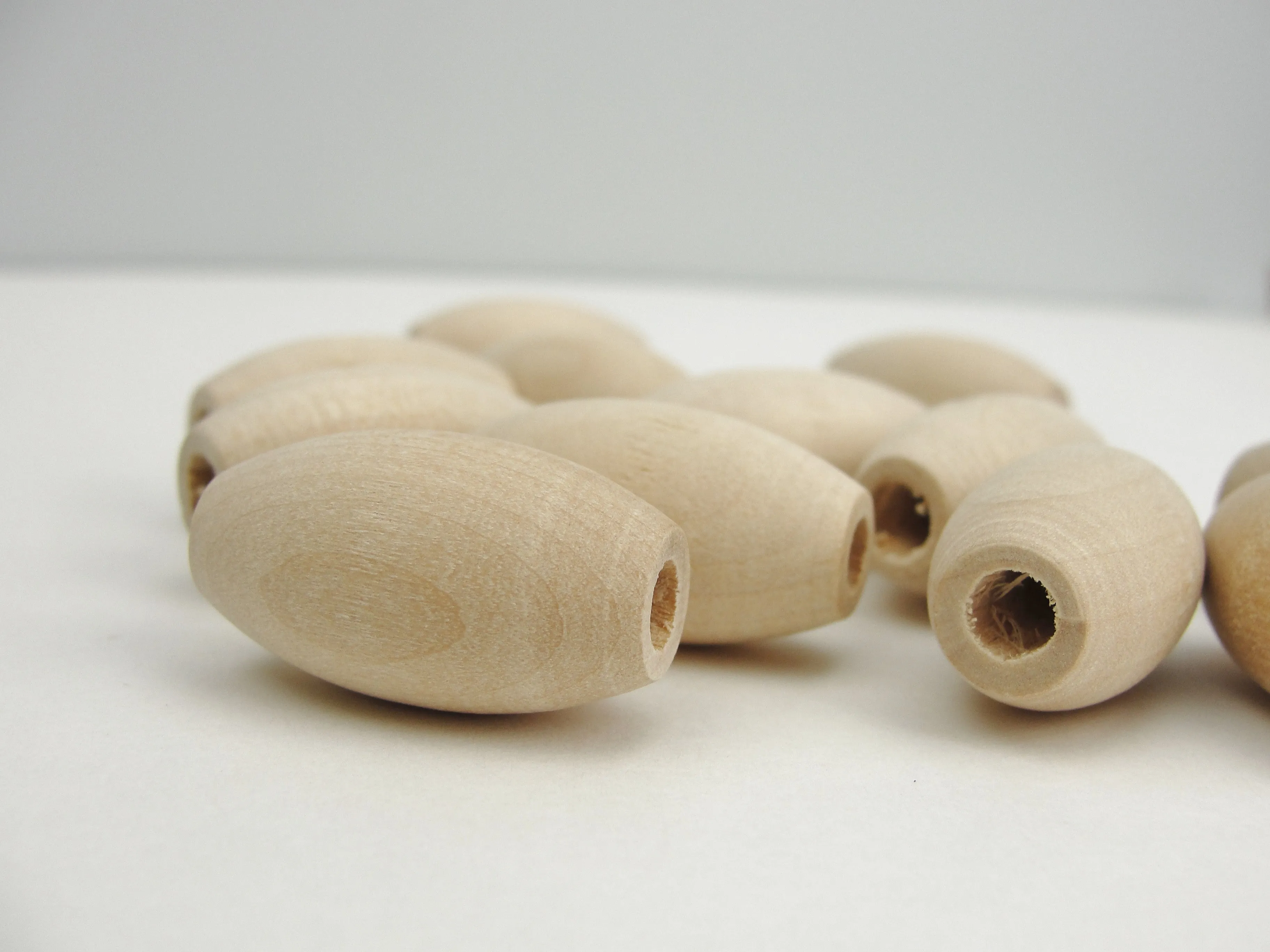 Wooden oval beads 1" x 9/16" with a 3/16" hole