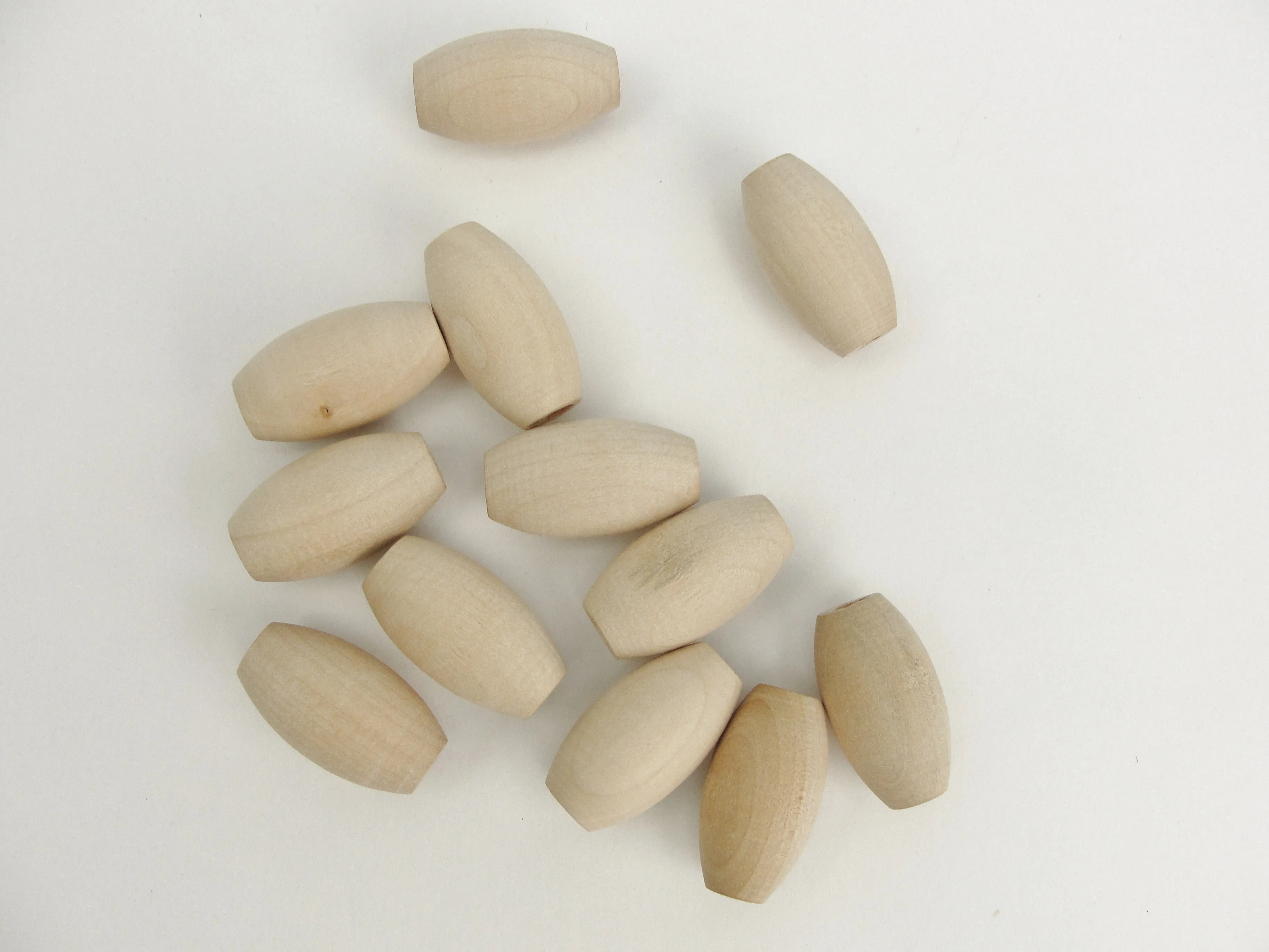 Wooden oval beads 1" x 9/16" with a 3/16" hole
